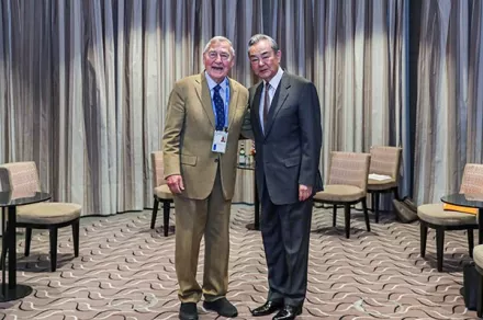 Graham Allison photographed with Wang Yi