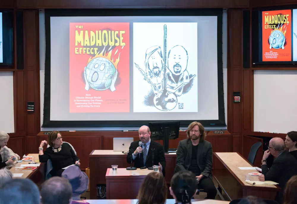 Moderator Cris Russel, award winning science journalist and Senior Fellow at the Environment and Natural Resources Program, introduces Mann and Toles.