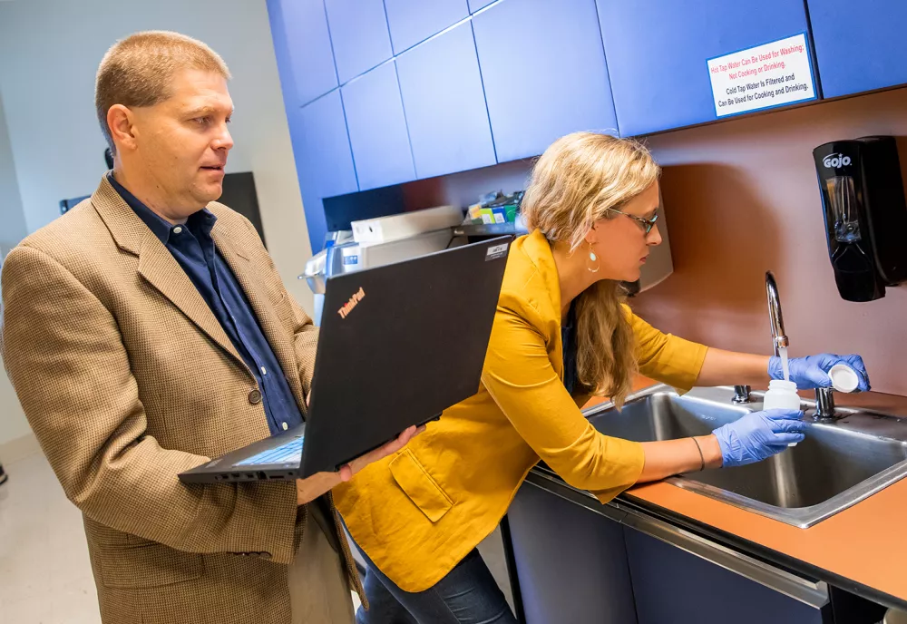 Members of the Clean Water for Carolina Kid team conduct water sampling. 