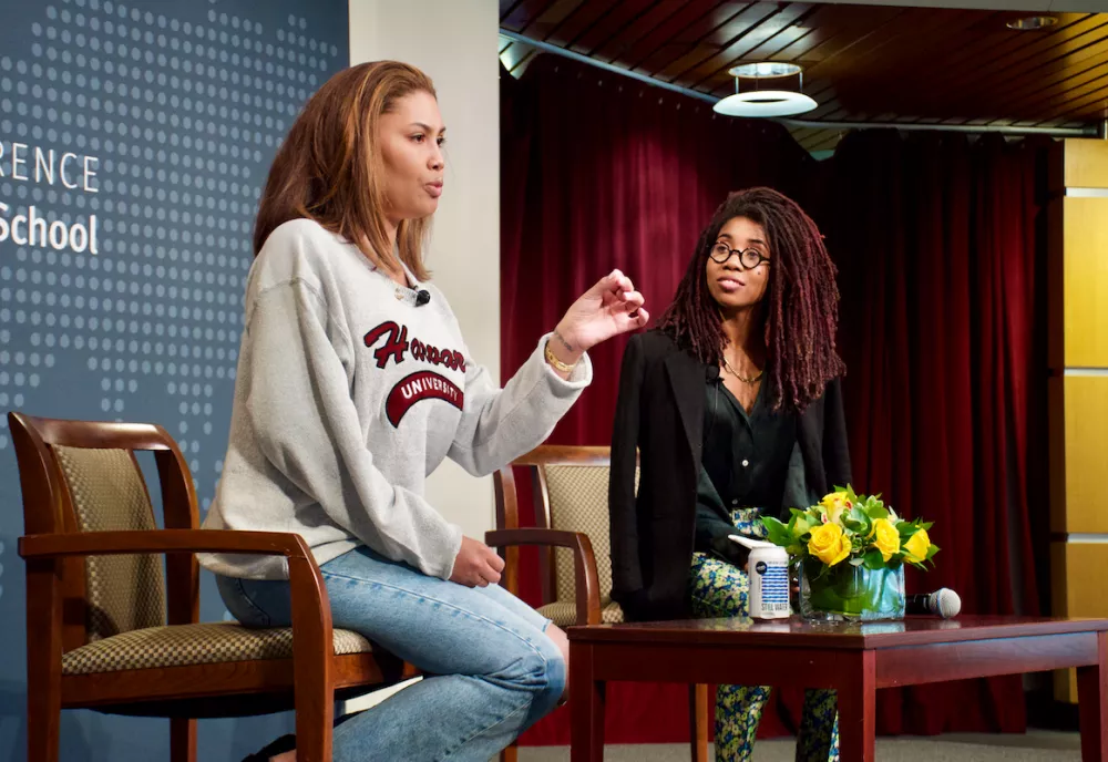Two speakers onstage at the conference.