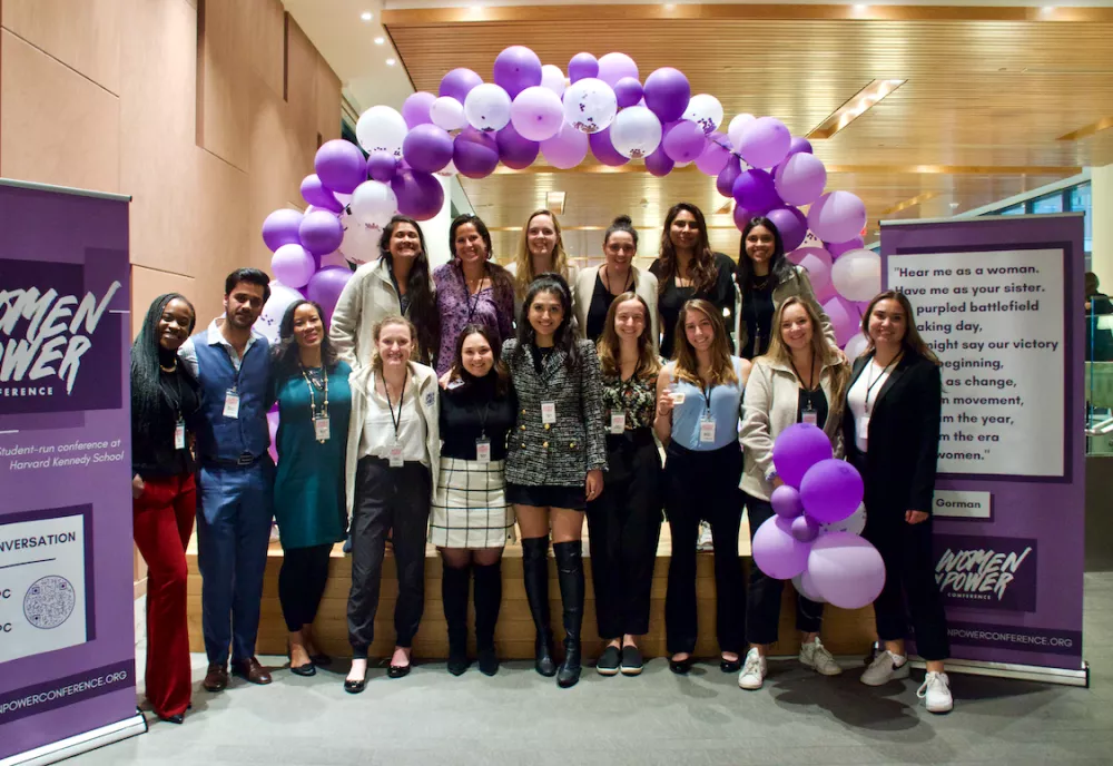 The conference organizers pose for a group photo.