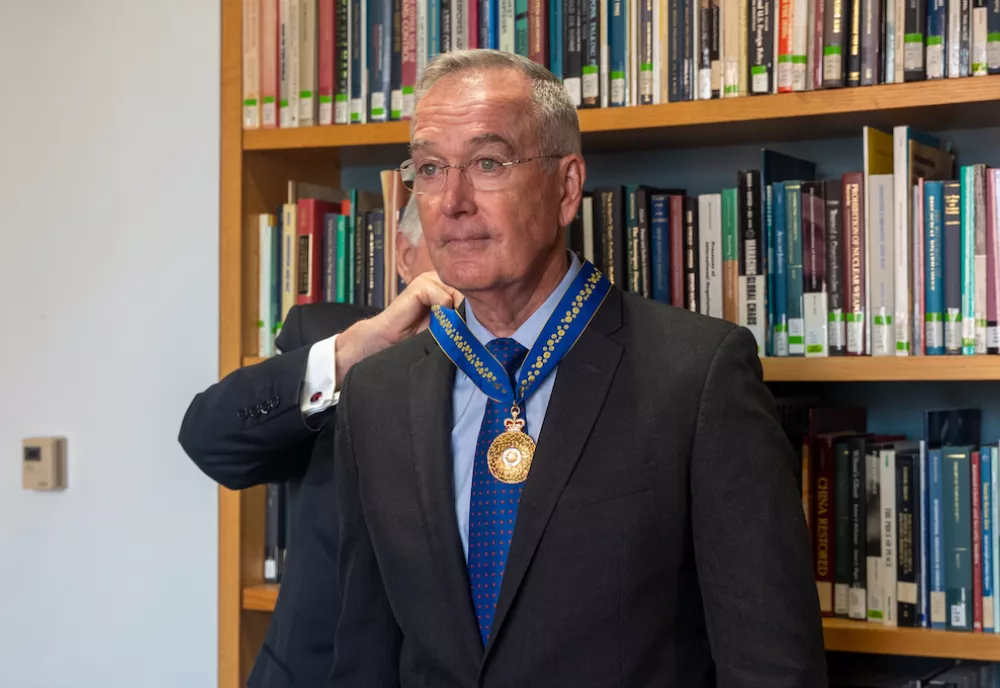 Joseph Dunford getting the Order of Australia medal placed around his neck.