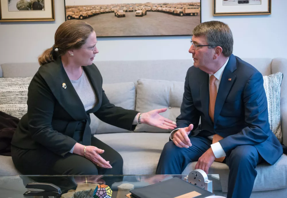 Laura Holgate and Ash Carter sitting on a couch in Ash's office.