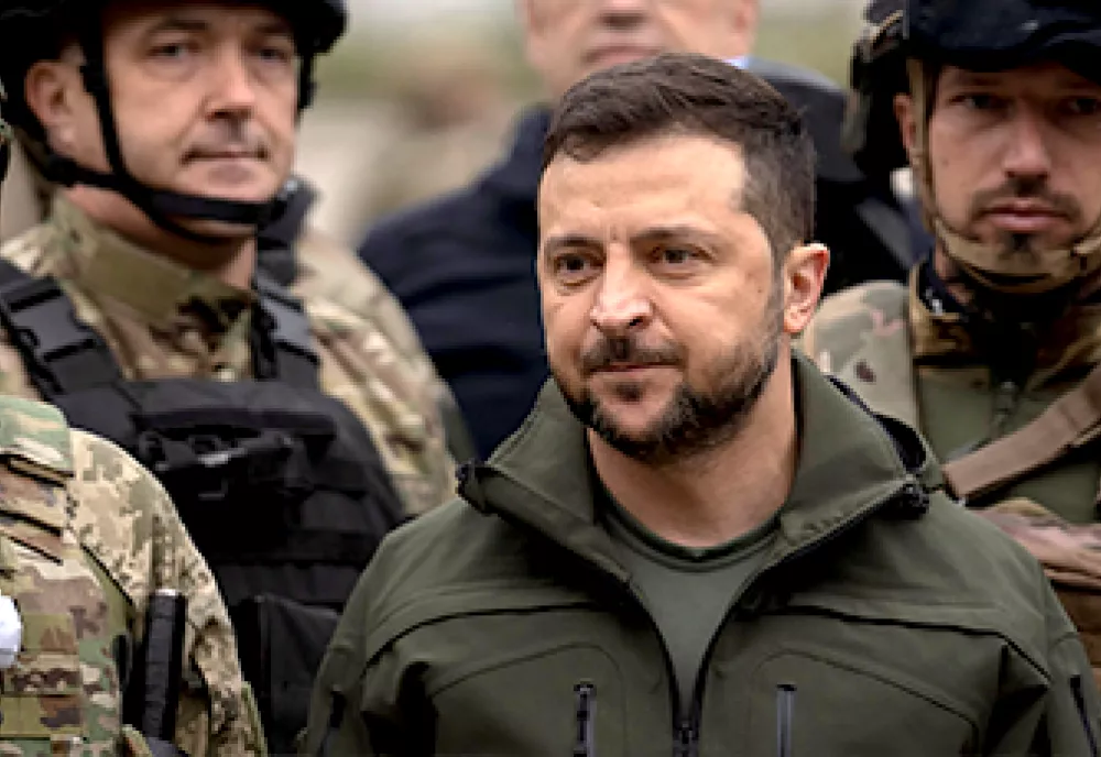 Ukrainian President Zelenskyy surrounded by soldiers.