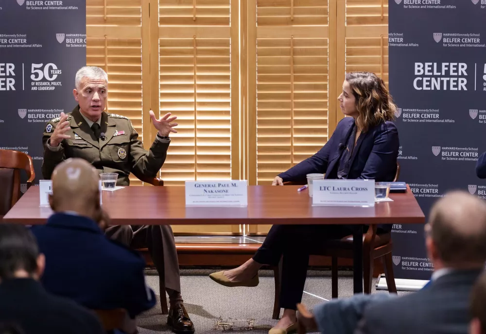General Nakasone and LTC Laura Cross at a panel table at a DETS event.