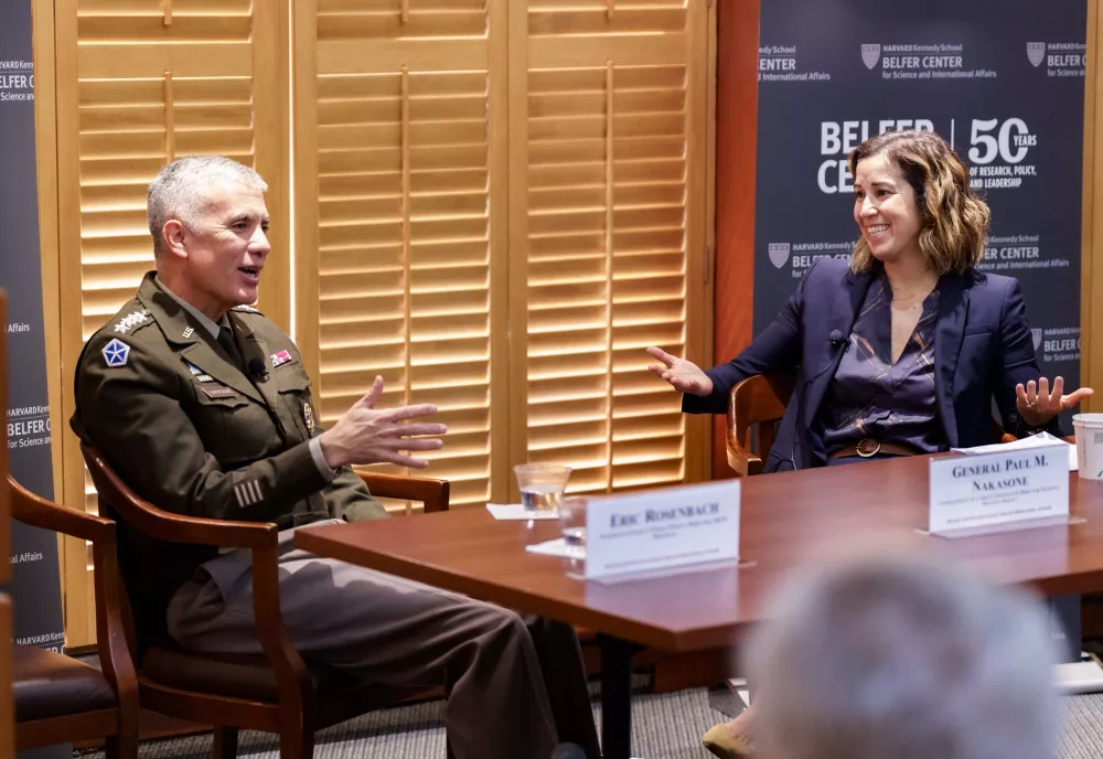 General Nakasone and LTC Laura Cross at a panel table during a DETS event.