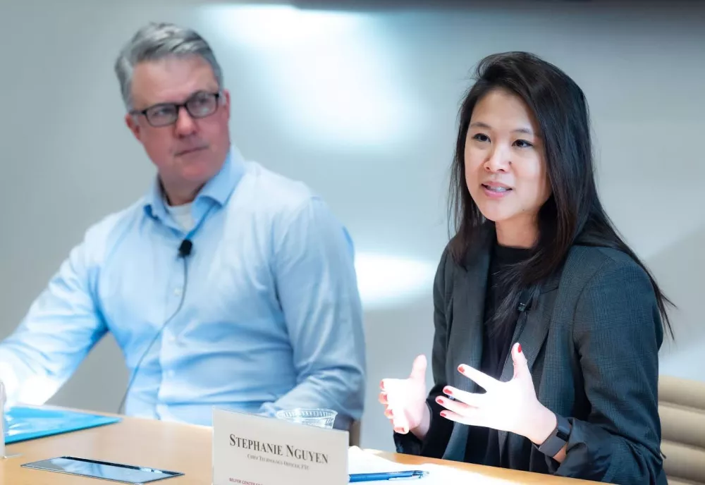 Image of Eric Rosenbach and Stephanie Nguyen at a table