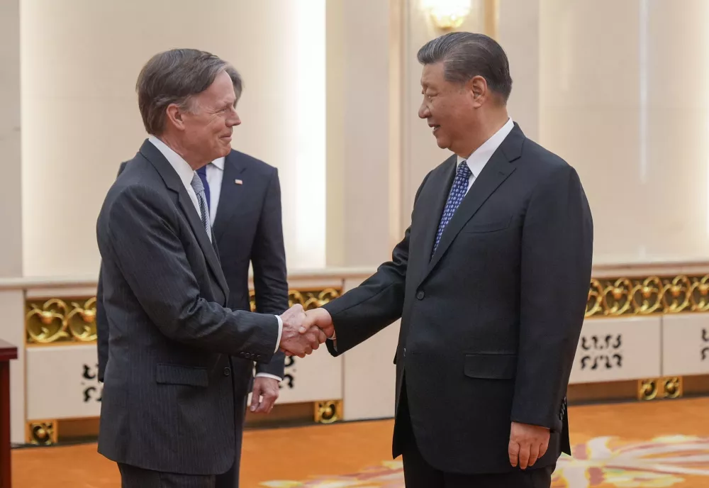 Ambassador Nicholas Burns shakes hands with Chinese President Xi Jinping.