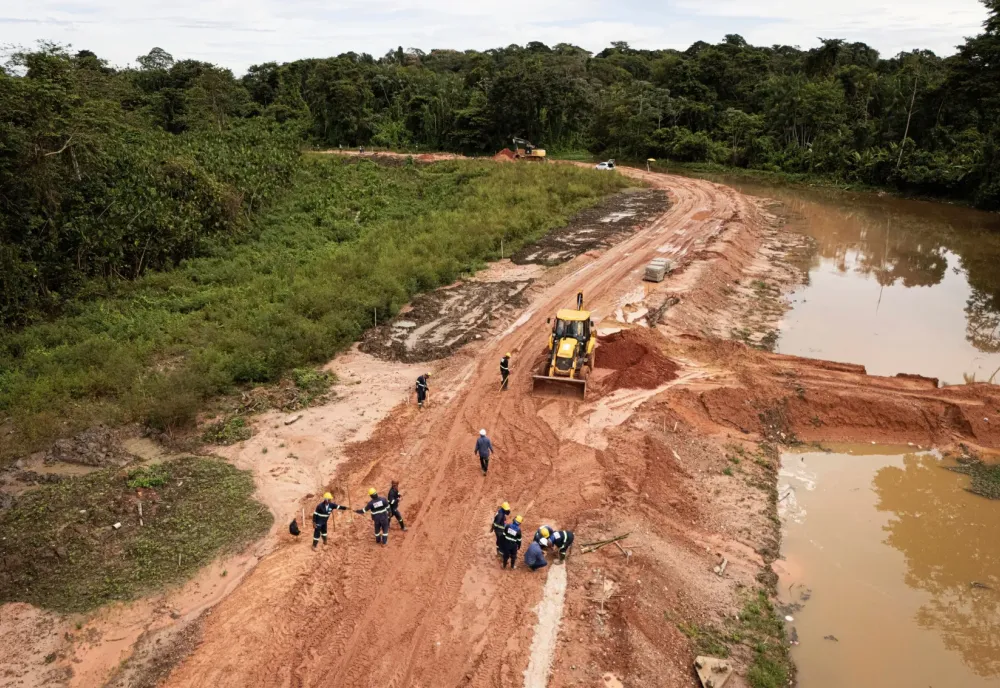Workers construct an avenue, named Liberdade, or Freedom, ahead of the COP30 U.N. Climate Summit in Belem, Brazil, March 18, 2025. (AP Photo/Jorge Saenz)
