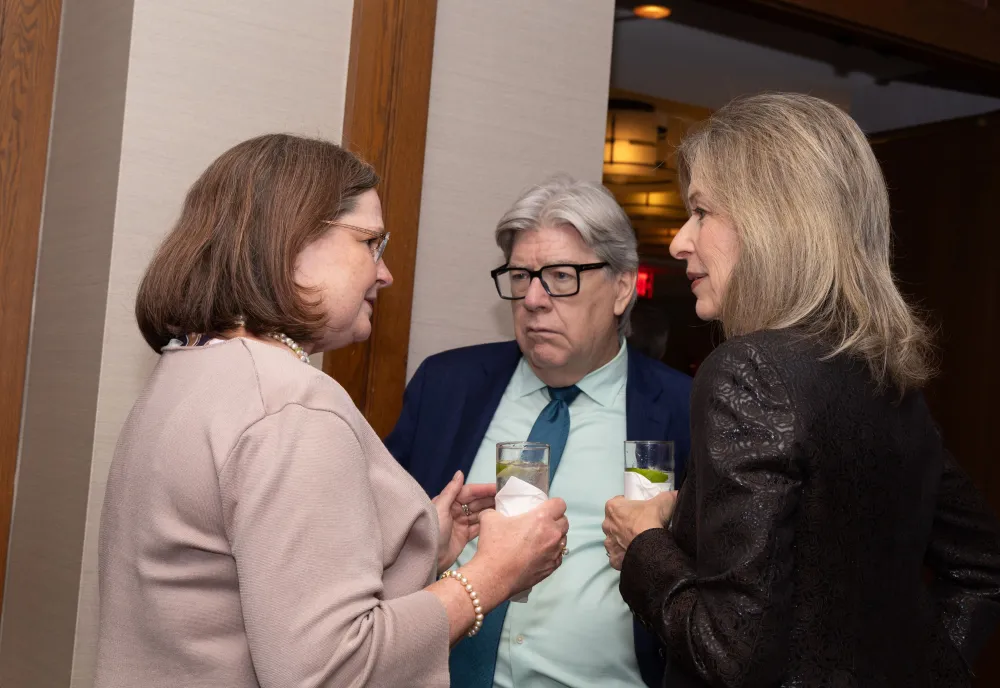 Laura Holgate, Michael McQuade, and Liz Sherwood Randall networking at the opening dinner April 2026 Spring Gathering
