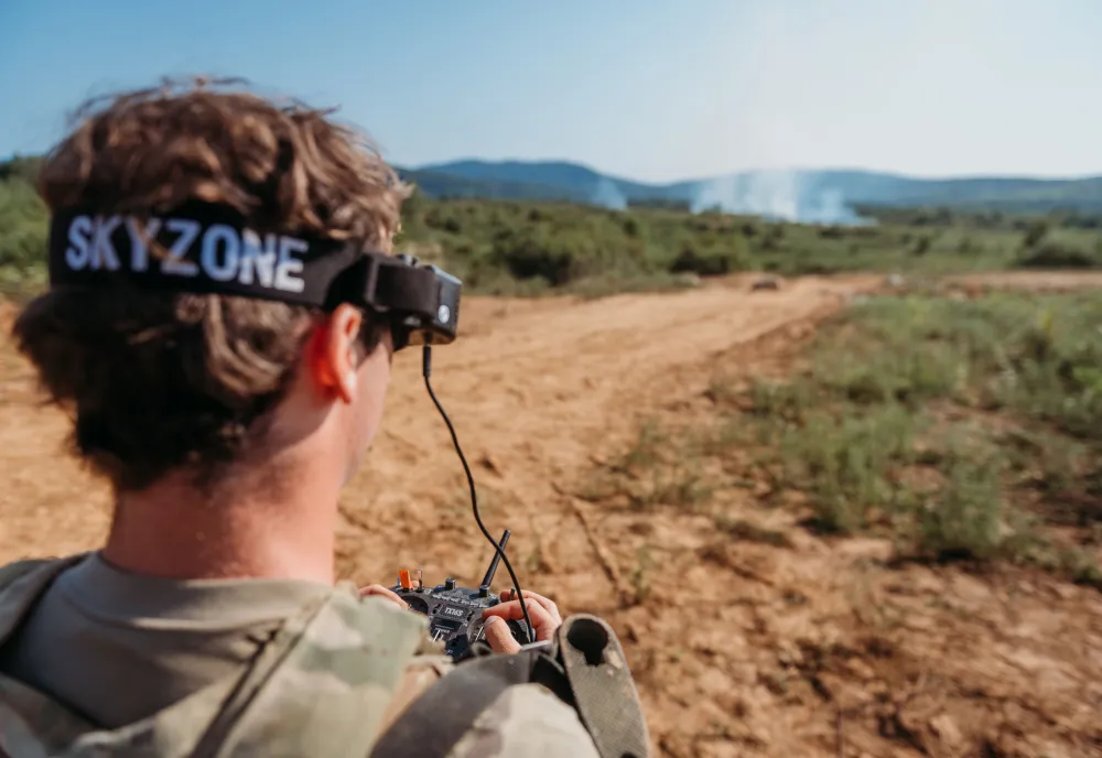 A soldier controls an FPV drone strike during training.