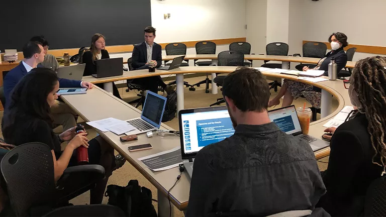 A wide shot of students making their pitch.
