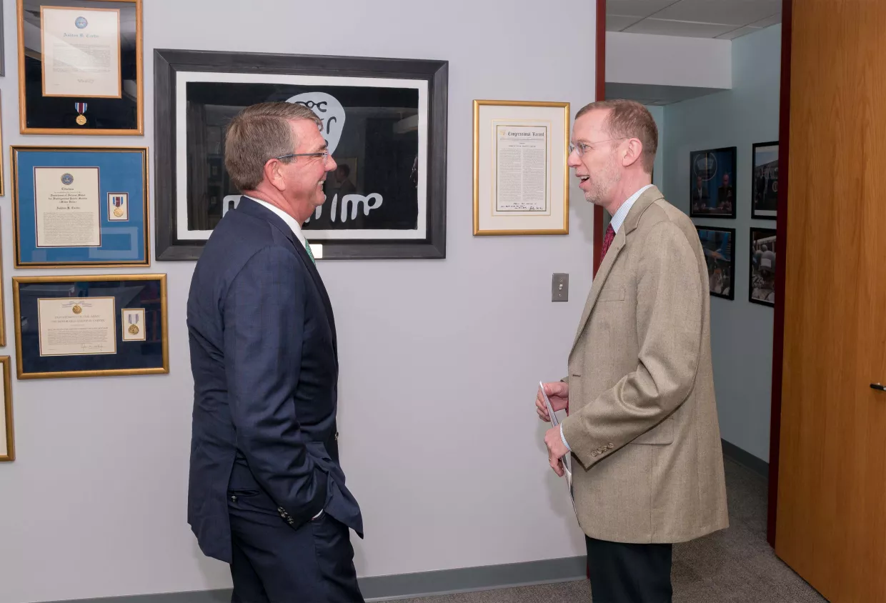 Ash Carter and Douglas Elmendorf stadning in Ash's office.