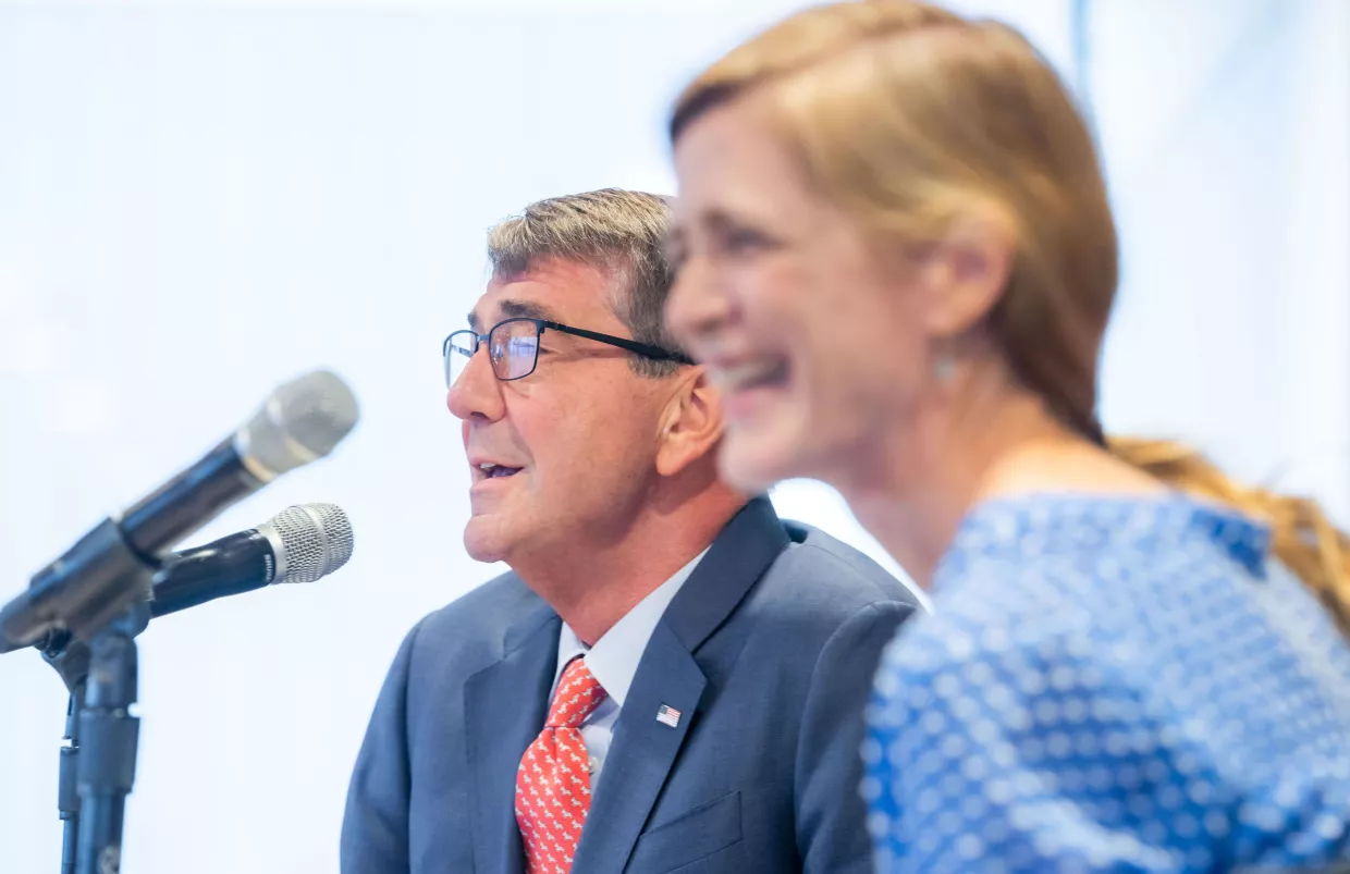 Amb. Samantha Power in the foreground out of focus and Ash Carter in the background in focus.