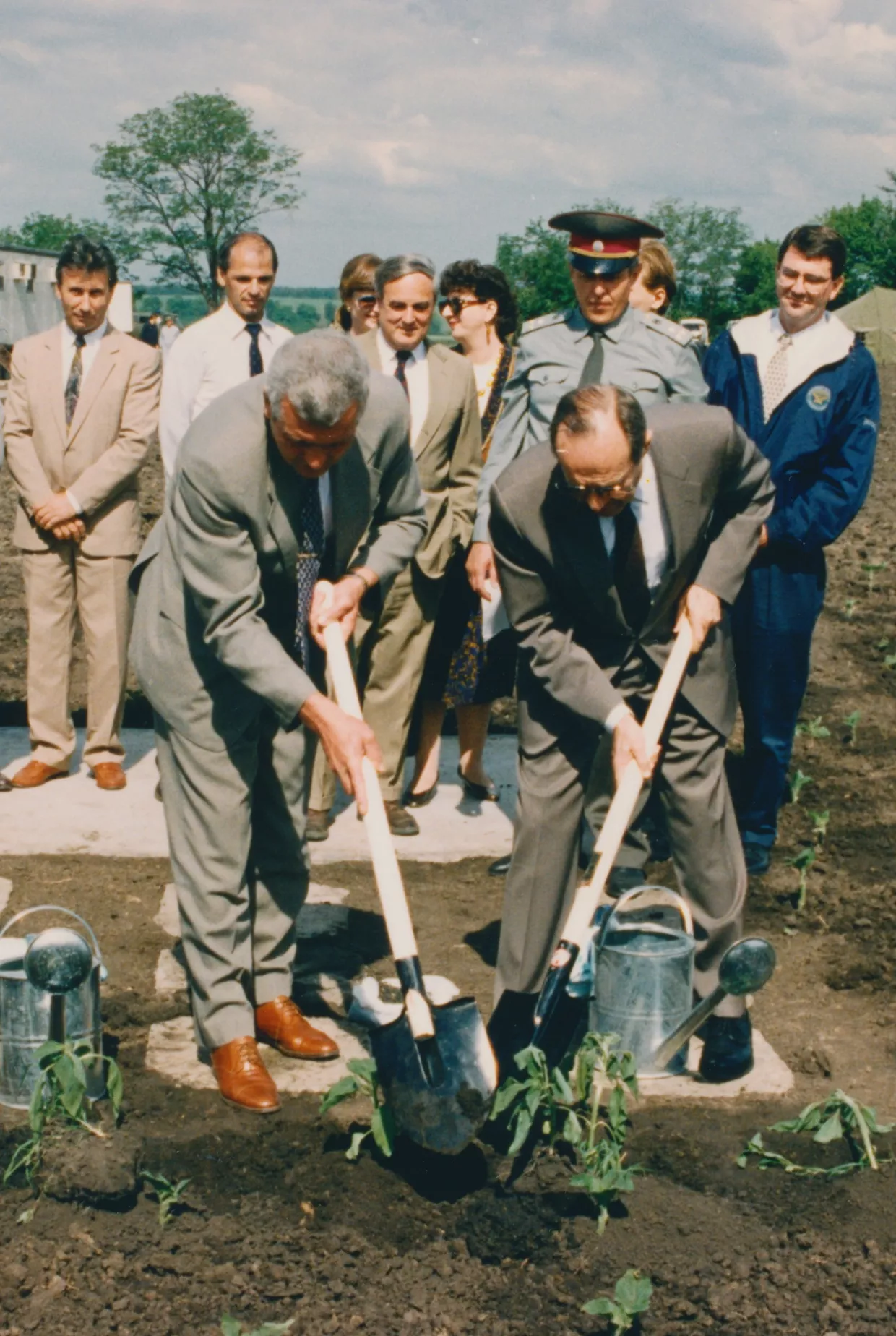 Ash Carter, far right, watches as then Secretary of Defense Bill Perry helps plant sunflowers atop the former site of a soviet nuclear missile silo that they had worked to dismantle in Pervomaysk, Ukraine in 1996.