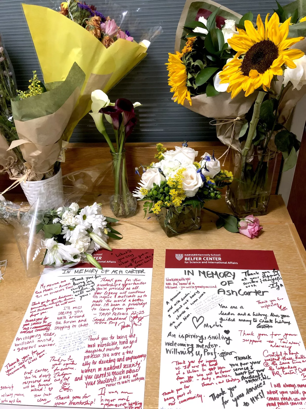 Notes and flowers outside of Ash Carter's Belfer Center office.