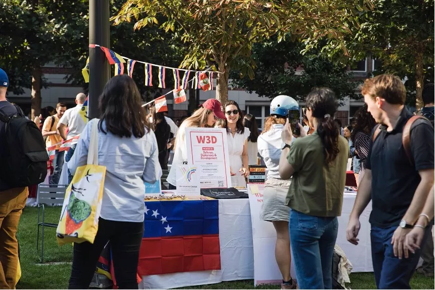 Co-Chairs Bethan Saunders and Brittney Vevaina tabling at the HKS Student Fair