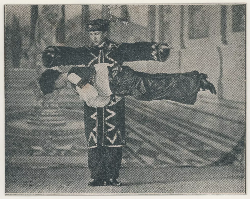 The magician Howard Thurston performing a levitation illusion.
