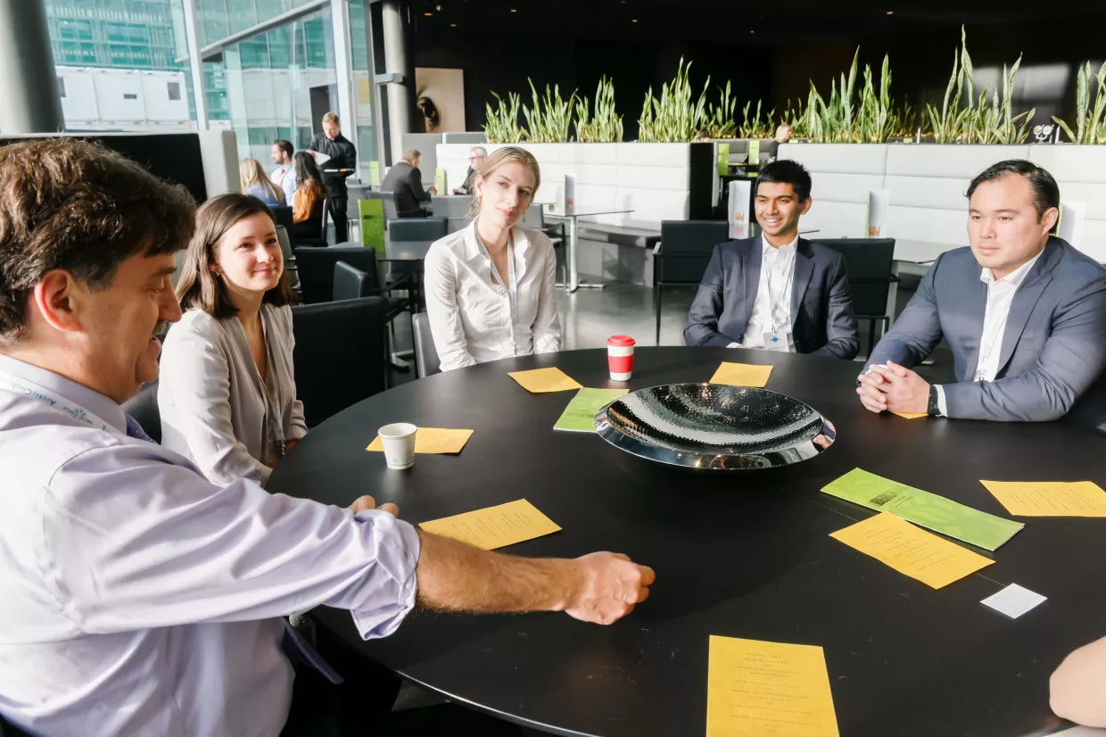 Photo of Harvard's student Arctic Innovators speaking in Iceland with Ambassador David Balton.