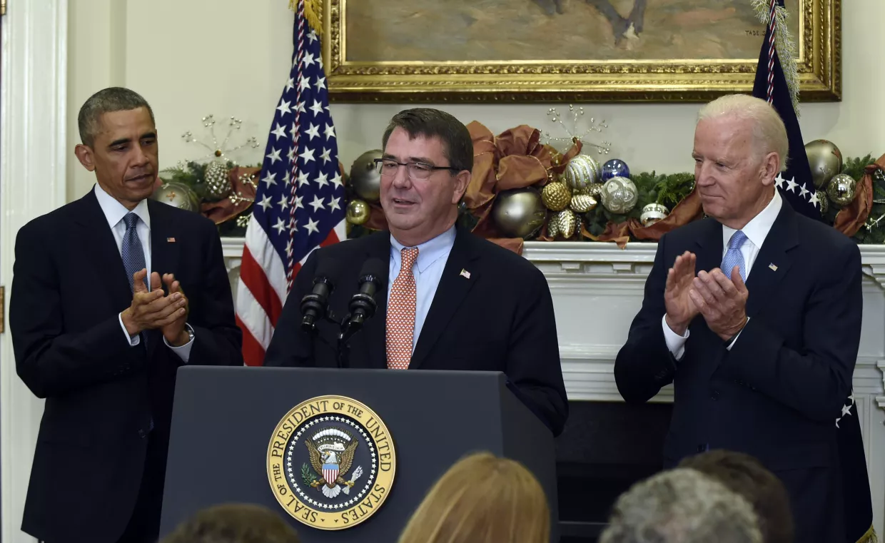 President Barack Obama and Vice President Joe Biden applaud as Ash Carter, Obama's nominee for defense secretary, speaks. 