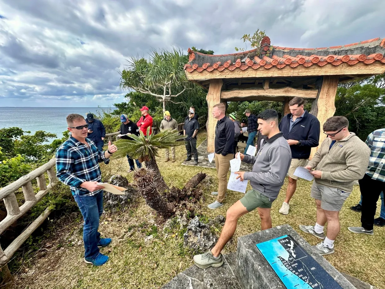 Image 1: U.S. Marines on a staff ride overlooking the landing beaches of Operation Iceberg, the amphibious invasion of Okinawa, Japan. 