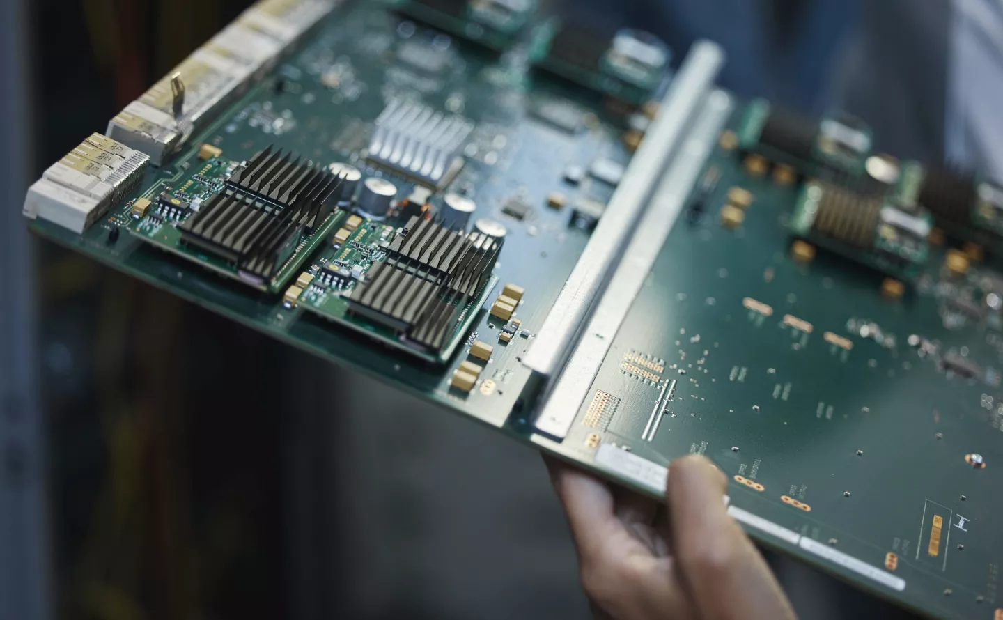 Network engineer, motherboard and server room for internet infrastructure and lights of computer. Hands, IT support and cybersecurity with neon, software and company information for cloud computing