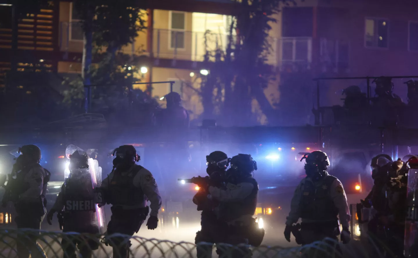 Law enforcement officers are seen during a protest in Compton, California, Saturday, June 7, 2025, following operations by federal immigration authorities.