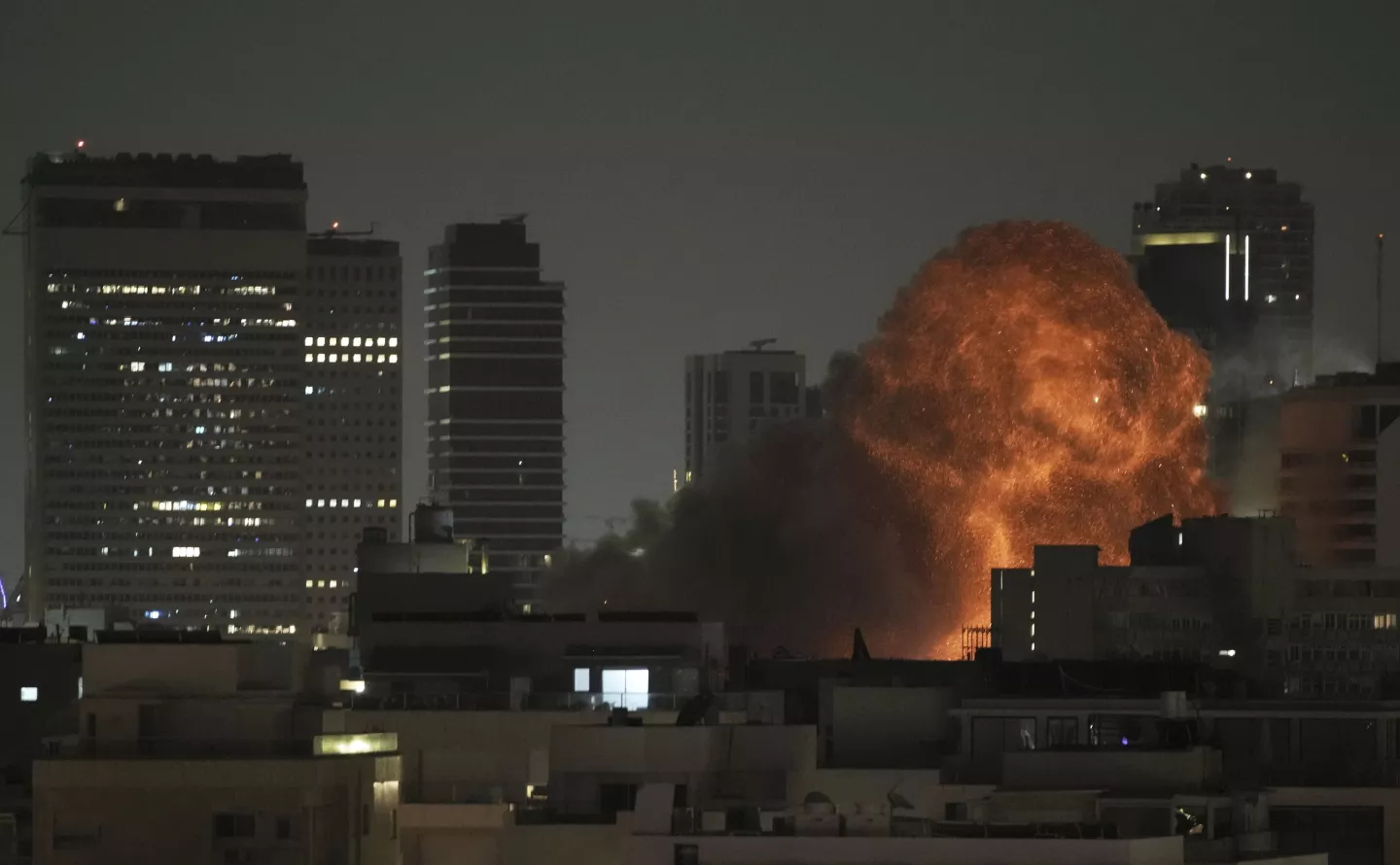 An explosion is seen during a missile attack in Tel Aviv, Israel, Sunday, June 15, 2025.