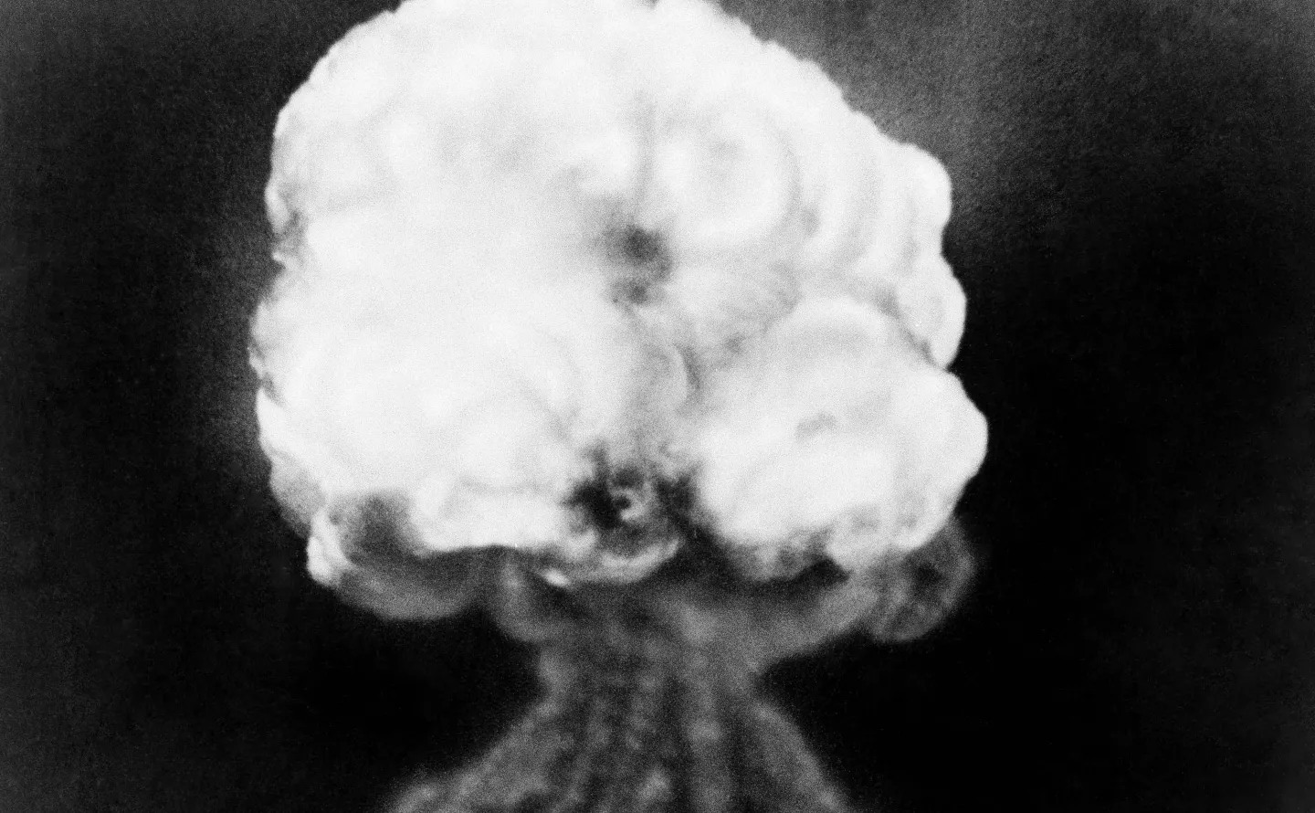 FILE - This July 16, 1945, file photo, shows the mushroom cloud of the first atomic explosion at Trinity Test Site near Alamagordo, N.M. A visit by The head of the National Nuclear Security Administration, Lisa Gordon-Hagerty coincides with the 75th anniversary of the Trinity Test in southern New Mexico, which marked the world's first atomic blast on July 16, 1945. She's scheduled to lead a commemoration Thursday, July 16, 2020, at the historic V-Site at Los Alamos National Laboratory, where early testing a
