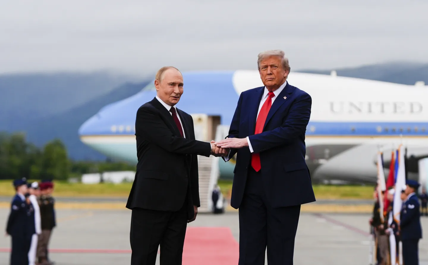 President Donald Trump greets Russia's President Vladimir Putin, Friday, Aug. 15, 2025, at Joint Base Elmendorf-Richardson, Alaska. (AP Photo/Julia Demaree Nikhinson)