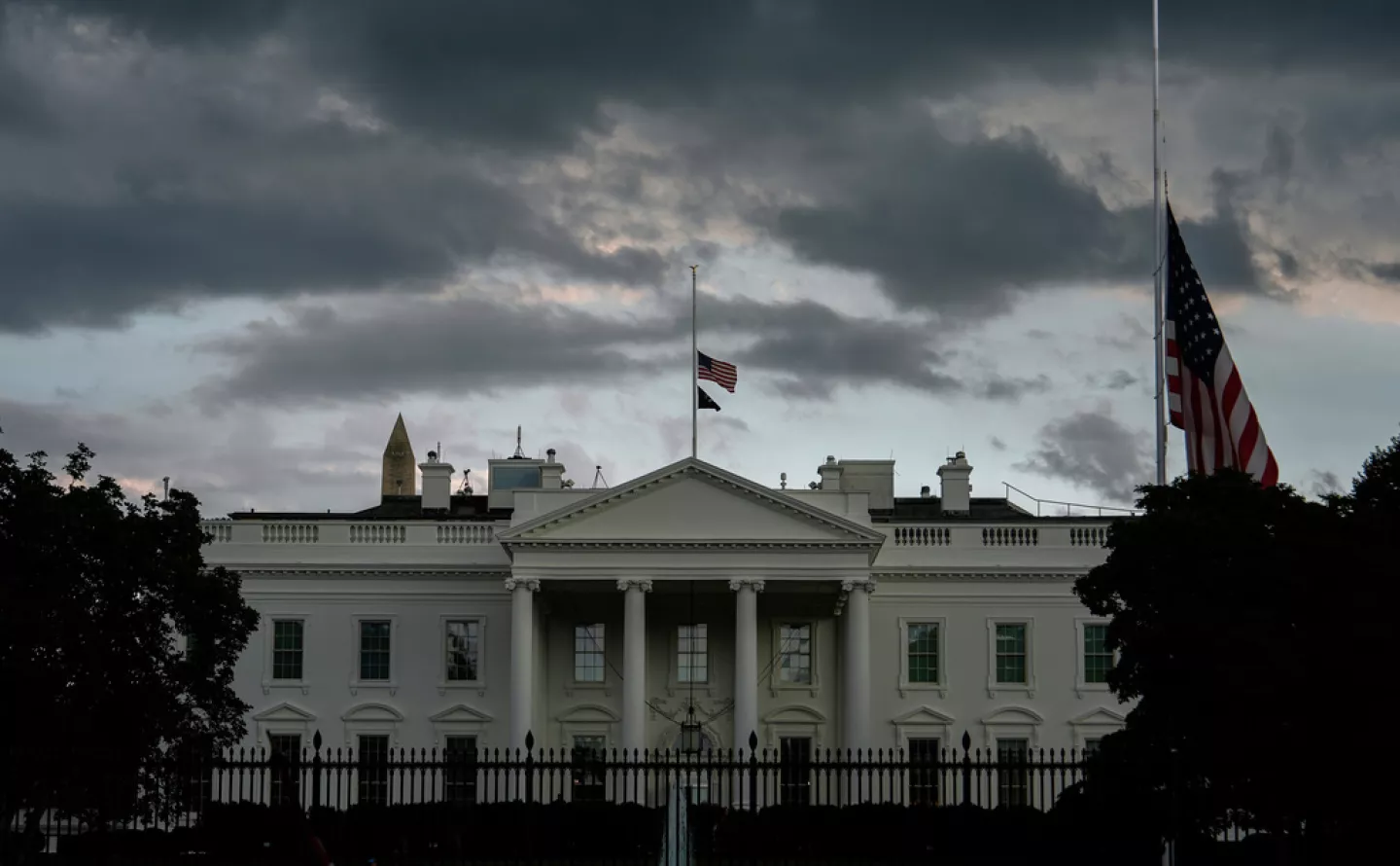American flags at the White House fly at half-staff after the death of Charlie Kirk, the CEO and co-founder of Turning Point USA, Thursday, Sept. 11, 2025, in Washington. (AP Photo/Julia Demaree Nikhinson)