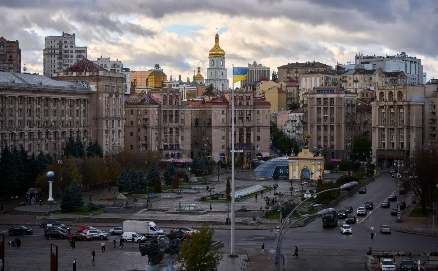 Ukrainian national flags waves on Independence square against the background of ancient St.Sophia Cathedral in central Kyiv, Ukraine, Monday, Oct. 13, 2025. (AP Photo/Efrem Lukatsky)
