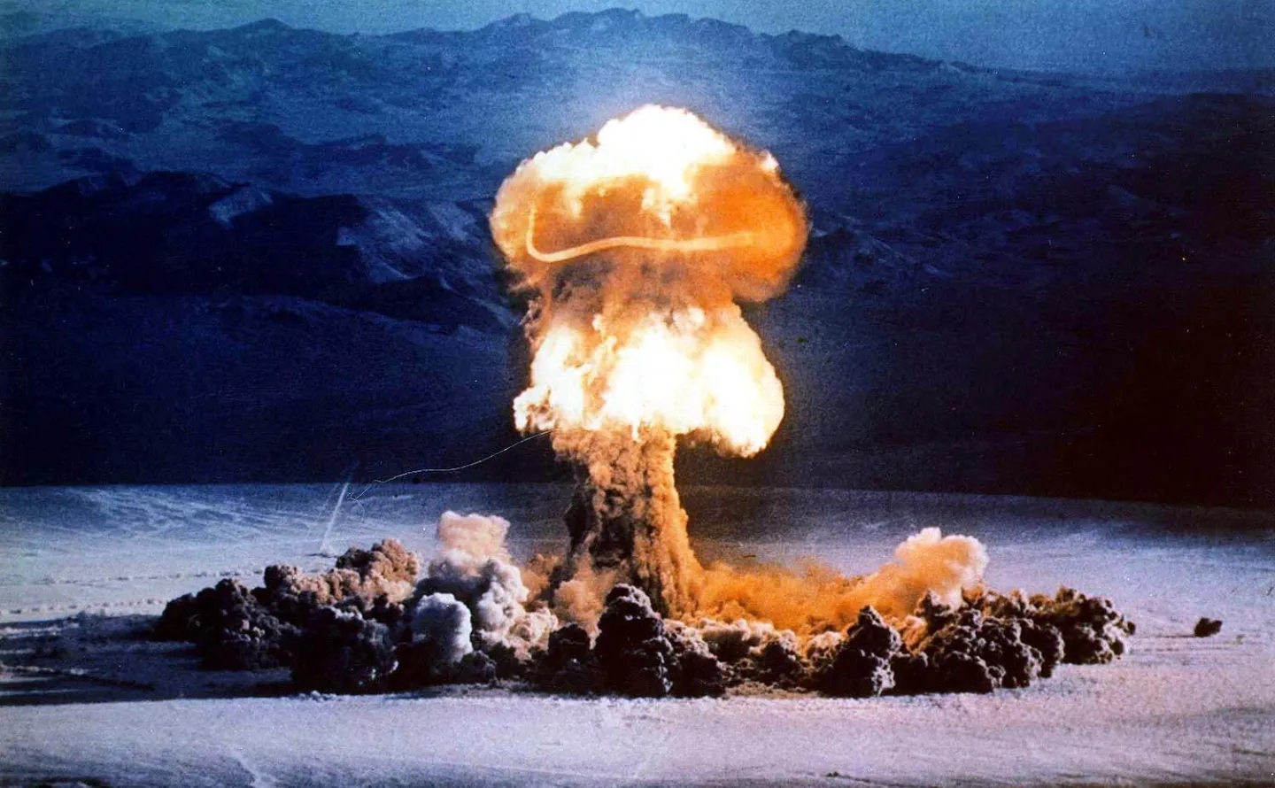 FILE - A mushroom cloud rises from a test blast at the Nevada Test Site on June 24, 1957. (U.S. Energy Department via AP, File)