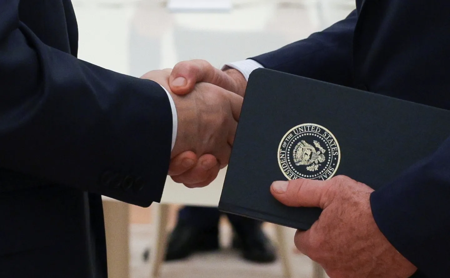 Russian President Vladimir Putin and U.S. President Donald Trump's special envoy Steve Witkoff shakes hands during their meeting at the Kremlin, in Moscow, on Aug. 6, 2025. (Gavriil Grigorov, Sputnik, Kremlin Pool Photo via AP, File)