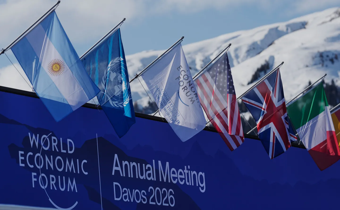Flags decorate the Congress Center where the Annual Meeting of the World Economy Forum take place in Davos, Switzerland, Monday, Jan. 19, 2026. (AP Photo/Markus Schreiber)