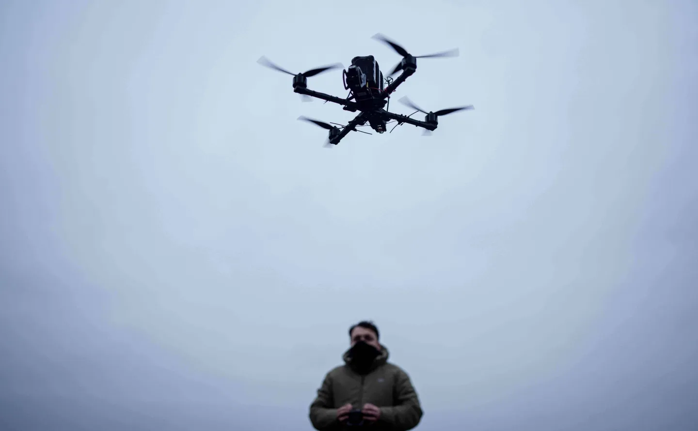 A serviceman controls an FPV drone of "General Cherry" company at the polygon in Ukraine, on Dec. 4, 2025. (AP Photo/Evgeniy Maloletka