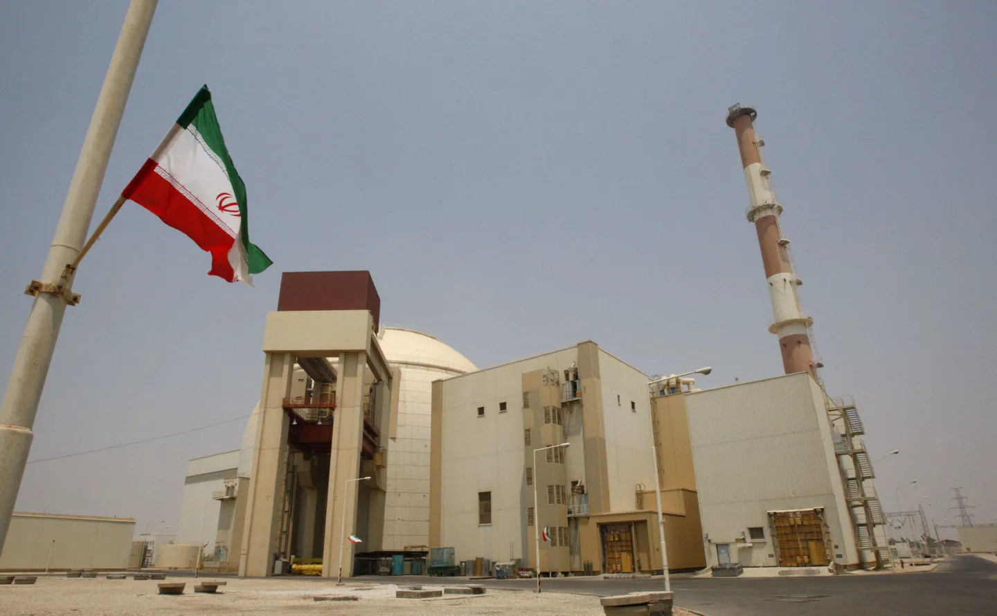 An Iranian flag flutters in front of the reactor building of the Bushehr nuclear power plant, just outside the southern city of Bushehr, Iran, Saturday, Aug. 21, 2010. (AP Photo/Vahid Salemi, File)