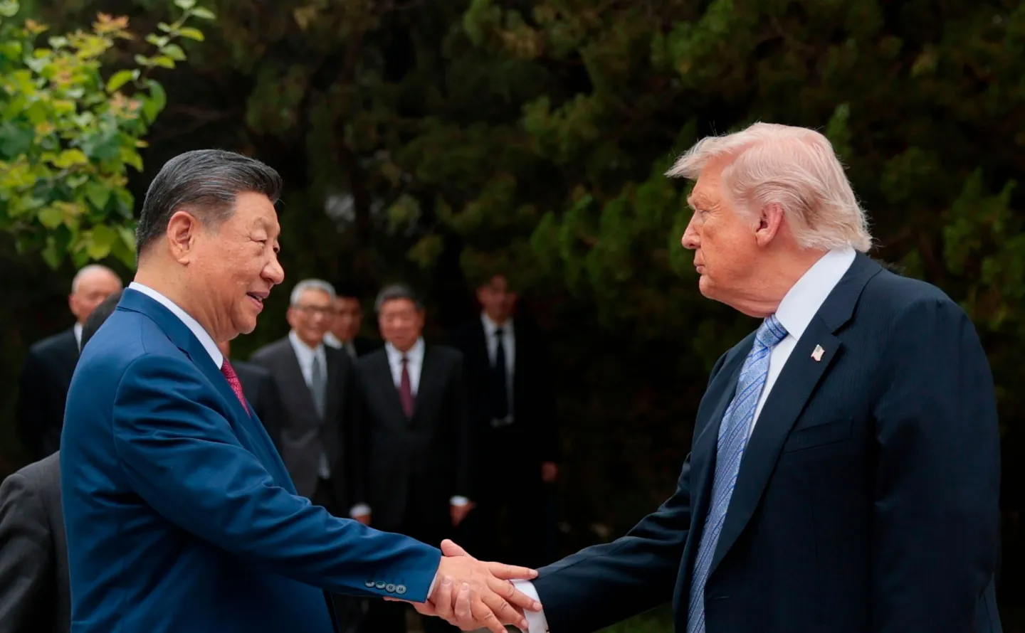 U.S. President Donald Trump, right, shakes hands with Chinese President Xi Jinping while leaving after a visit to the Zhongnanhai Garden in Beijing, Friday, May 15, 2026. (Evan Vucci/Pool Photo via AP)