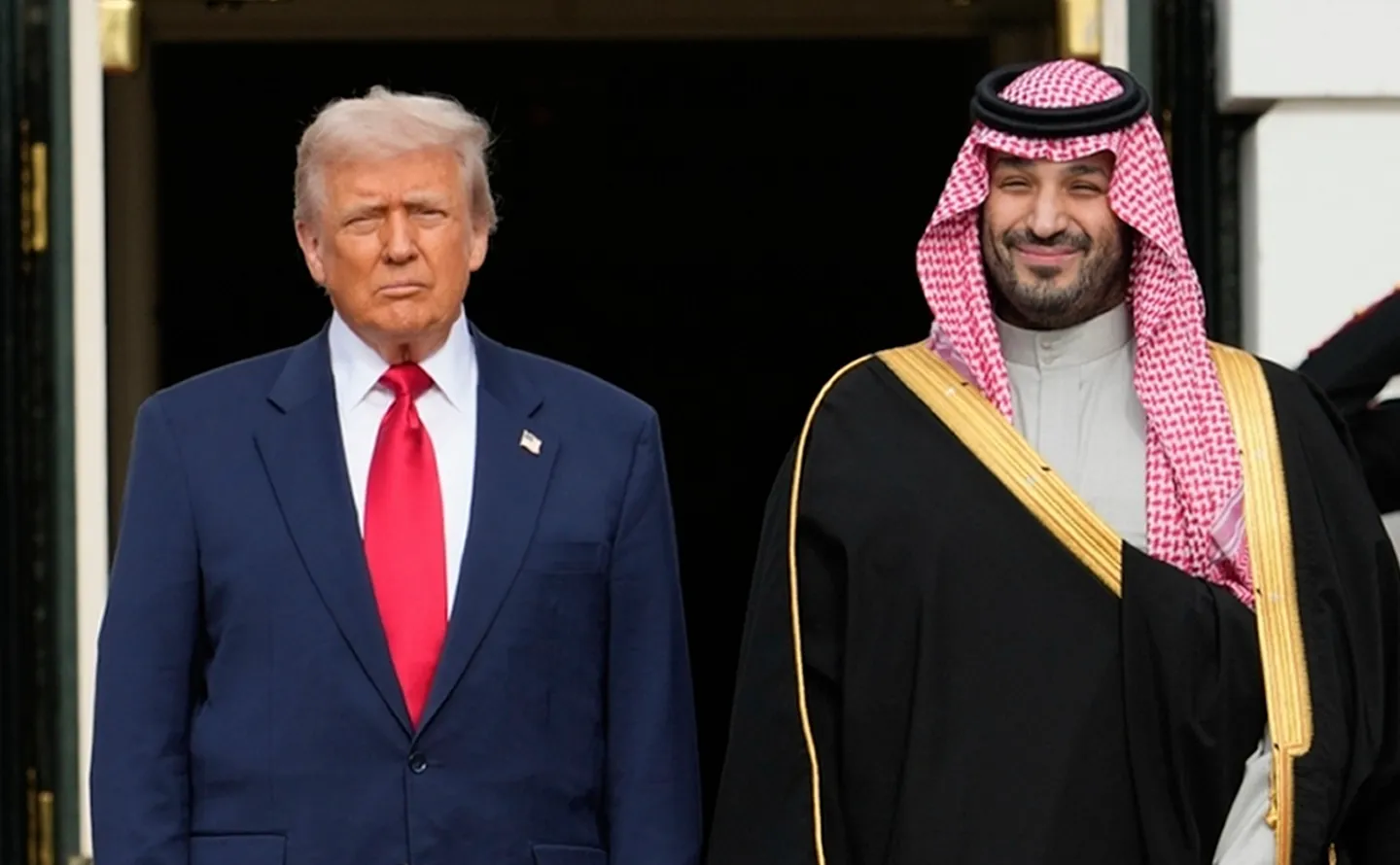 President Donald Trump stands with Saudi Arabia's Crown Prince Mohammed bin Salman on his visit to the White House, Nov. 18, 2025, in Washington. (AP Photo/Mark Schiefelbein, File)