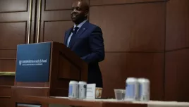 Ambassador Martin Kimani speaking at a podium