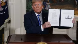 U.S. President Donald Trump shows a signed Presidential Memorandum after delivering a statement on the Iran nuclear deal from the Diplomatic Reception Room of the White House, on May 8, 2018. Iran will elect a new president Friday, June 28, 2024, after the death of hard-line President Ebrahim Raisi. Whoever takes the helm in the country will inherit Iran's rapidly advancing nuclear program, which now enriches uranium closer than ever to weapons-grade levels.