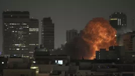 An explosion is seen during a missile attack in Tel Aviv, Israel, Sunday, June 15, 2025.