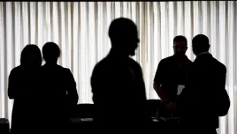 silhouettes of small groups talking