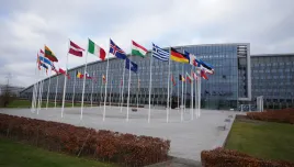 Flags flap in the wind outside of NATO headquarters in Brussels, Wednesday, Dec. 3, 2025. (AP Photo/Virginia Mayo)