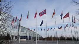 Flags flap in the wind outside NATO headquarters in Brussels, Monday, Jan. 19, 2026. (AP Photo/Virginia Mayo)
