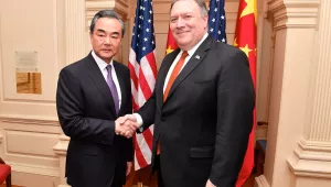 Secretary Pompeo Shakes Hands With Chinese State Councilor and Foreign Minister Wang Yi