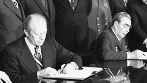 U.S. President Gerald Ford and Soviet Communist Party Chief Leonid Brezhnev sign the joint communiqué at the conclusion of their two days meeting near Vladivostok, Nov. 24, 1974.