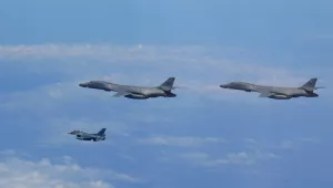 Two U.S. Air Force B-1B Lancers assigned to the 9th Expeditionary Bomb Squadron, deployed from Dyess Air Force Base, Texas, fly with a Koku Jieitai (Japan Air Self-Defense Force) F-2 fighter jet over the East China Sea, July 7.