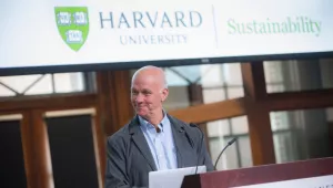 Portrait of Professor Bill Clark giving a lecture at a Harvard Sustainability event
