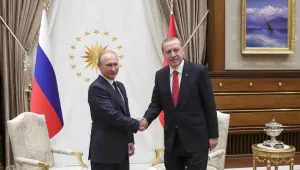 Turkey's President Recep Tayyip Erdogan, right, shakes hands with Russian President Vladimir Putin 